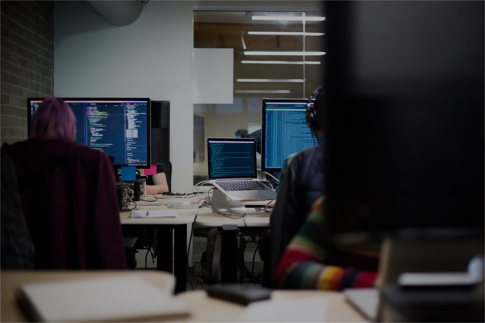 A person sitting in front of computer receiving calls